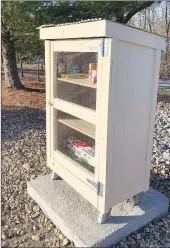  ?? Sally Carroll/Special to The Weekly Vista ?? This free little food pantry box is usually stocked with various non-perishable food items for Bella Vista neighbors to take as they need. Fellow neighbors stocked the pantry before the holidays with a frozen turkey and the fixings for a Christmas dinner.