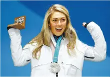  ?? AP-Yonhap ?? Silver medalist in the women’s combined Mikaela Shiffrin, of the United States, celebrates during the medals ceremony on Feb. 22, 2018 at the 2018 Winter Olympics in Pyeongchan­g, South Korea.