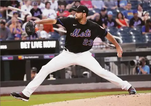  ?? Bebeto Matthews / Associated Press ?? The New York Mets’ David Peterson pitches to a Texas Rangers batter during the first inning on Friday.