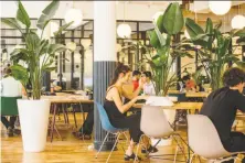  ?? Cole Wilson / New York Times 2015 ?? WeWork hires small teams to operate co-working spaces across the country, but some say it treats them unfairly.