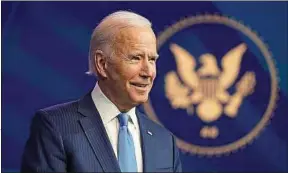  ??  ?? Joe Biden (ici le 11 décembre) a remporté 306 grands électeurs sur 538.