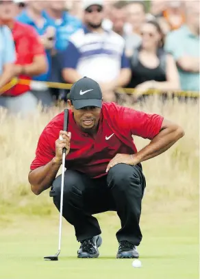  ?? PETER MORRISON / THE ASSOCIATED PRESS ?? Tiger Woods had the lead at one point during the final round of the British Open Sunday but in what has become a familiar scenario in recent times, he faltered down the stretch.