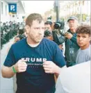  ??  ?? A TRUMP backer squares off against protesters who were following him after the campaign rally in San Jose.