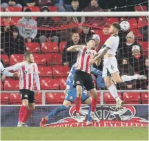  ?? ?? Plymouth’s Dan Scarr heads in to make the score 2-1.