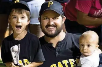  ??  ?? Leland, 6, shown with his dad and younger brother, passed away Sept. 25 from a rare brain infection.