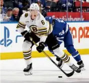  ?? CLAUS ANDERSEN/GETTY IMAGES ?? Heads-up play by rookie defenseman Mason Lohrei helped the Bruins win Game 4 over the host Maple Leafs.