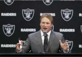  ?? MARCIO JOSE SANCHEZ — THE ASSOCIATED PRESS ?? Oakland Raiders new head coach Jon Gruden answers questions during an NFL football press conference Tuesday in Alameda, Calif.