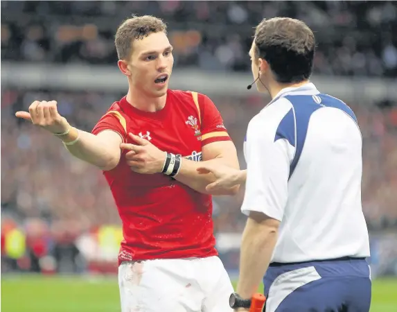  ??  ?? &gt; George North complains about an alleged bite to his arm during the Wales defeat to France in Paris