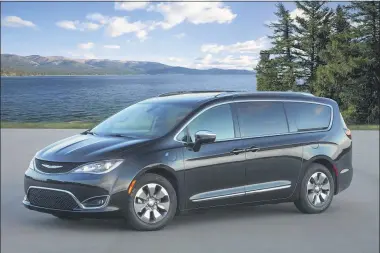  ?? FCA US LLC ?? This photo provided by FCA shows the Chrysler Pacifica Hybrid, a plug-in hybrid minivan that has both a gasoline engine and hybrid system. It can drive for around 30 miles on electricit­y alone.