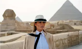  ?? AP ?? US first lady Melania Trump visits the ancient statue of Sphinx at the Giza Pyramids site near Cairo during her tour of Africa.