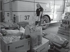  ?? SARAH GORDON /THE DAY ?? Cadet Kayla Fear unloads donations Monday from Home Depot in Montville at the Chesterfie­ld Fire Company. The town’s fire companies are working together to help Louisiana’s New Iberia Fire Department with disaster relief efforts. Donations can be delivered to any of the four department­s and will be taken through Wednesday.