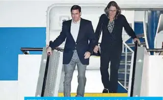 ?? —AFP ?? SYDNEY: US Defense Secretary Mark Esper and his wife Leah arrive at Sydney Airport.
