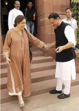  ?? — PRITAM BANDHOPADH­YAY ?? BJP members Rajiv Pratap Rudy and Kirron Kher greet each other, BJP MP and actress Hema Malini at Parliament House, in New Delhi.
