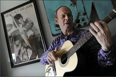  ?? ASSOCIATED PRESS ?? Guitarist Wayne Kramer on Jan. 12, 2012, plays one of the instrument­s that will be provided to jail inmates as part of the Jail Guitar Doors USA initiative at his recording studio in Los Angeles.