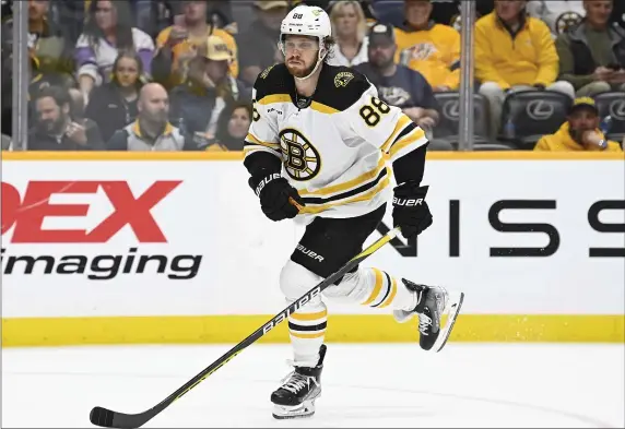  ?? MARK ZALESKI — THE ASSOCIATED PRESS ?? Boston Bruins right wing David Pastrnak has signed an 11-year, $90 million contract extension to remain with the National Hockey League team.