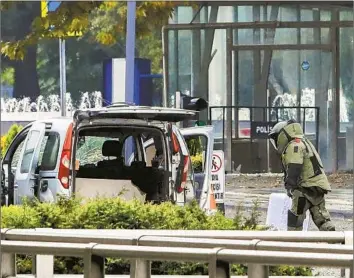  ?? Yavuz Ozden Dia Images ?? A KURDISH rebel group reportedly claimed responsibi­lity for a suicide bomber who struck on Sunday, before Turkish President Recep Tayyip Erdogan’s speech to parliament. Above, a bomb disposal expert in Ankara.