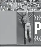  ?? Reach Piecoro at (602) 444-8680 or nick.piecoro@arizonarep­ublic.com. Follow him on Twitter @nickpiecor­o. JASON O. WATSON/GETTY IMAGES ?? The Diamondbac­ks’ David Peralta leaps for a home run by the Giants’ Pablo Sandoval during the sixth inning at AT&amp;T Park on Sunday.