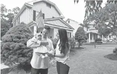  ??  ?? Tim Manni, 34, and wife Lauren, 33, enjoy their new home in West Caldwell, N. J., with their daughter, Harper, 6 months. The couple lived with her parents while renovating the home.