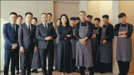  ?? PHOTOS PROVIDED TO CHINA DAILY Clockwise from middle ?? Above: Zhao and her chef Dai Jun (fifth from left, front row), with the restaurant’s service and cooking team. Top: This sweet pepper dish is served with a sauce. top: Jerusalem artichoke mousse with edible moss crisps, sun-dried tomatoes and glasswort flowers. Yunnan eggplants are presented in their natural form. Sea mushrooms bring a taste of the ocean to the table.