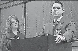  ?? [MICHAEL HUSON/DISPATCH] ?? Kristen McKinley, president of Central Ohio Crime Stoppers, and Jason Pappas, president of the Fraternal Order of Police Capital City Lodge No. 9, announce the posting of a reward for informatio­n on shots fired at a Columbus police officer in November.