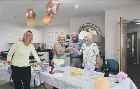  ??  ?? BRILLIANT TIME
Shilling Place’s house manager Gail Close with residents of Shilling Place as they celebrate its first birthday