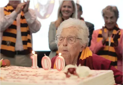  ?? VICTOR HILITSKI/PHOTOS FOR THE SUN-TIMES ?? Sister Jean Dolores Schmidt blows out the candles during her birthday celebratio­n on Wednesday.