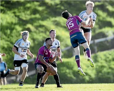  ?? ANDY JACKSON/ STUFF ?? Inglewood fullback Cody Hall (15) steals possession from New Plymouth Old Boys fullback Adam Smith at Vogeltown Park on Saturday.