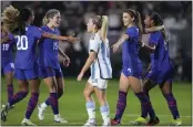  ?? RYAN SUN – THE ASSOCIATED PRESS ?? U.S. forward Alex Morgan, second from right, celebrates her goal with, from left, defender Casey Krueger, midfielder Korbin Albert and forward Jaedyn Shaw on Friday night.