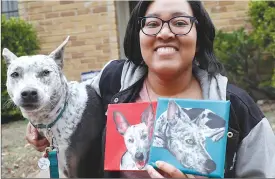  ?? Associated Press photo ?? Danielle Moore poses for photos with Kana and also paintings of the pet Australian cattle dog in Dallas. In the dog-eat-dog world of online shopping, Chewy has an unusual plan to fend off Amazon: turning pets into works of art. The online pet shop surprises customers with oil paintings of their furry friends, a move the company says wins them customers for life.