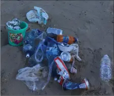  ??  ?? LEFT (Above and below): Typical scenes in and around Brittas Bay, where beach-goers are leaving all sorts of rubbish behind them after a day in the sun.