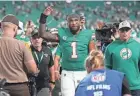  ?? JIM RASSOL/THE PALM BEACH POST ?? Miami quarterbac­k Tua Tagovailoa (1) walks off the field following Sunday’s victory over Dallas in Miami Gardens.