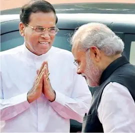  ??  ?? NAMASTHE SIR: File photo of Lankan President Sirisena greeting Indian Prime Minister Modi