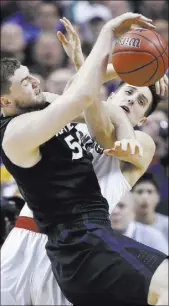  ??  ?? Gonzaga’s Zach Collins, right, the former Bishop Gorman standout, tangles with Xavier’s Sean O’Mara for a rebound.