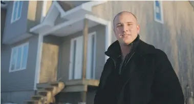  ?? VIKTOR PIVOVAROV/NATIONAL POST ?? Pierre Martell, president and CEO of Martell Home Builders, poses in front of a home under constructi­on in Moncton, N.B. He build homes with a 99-day timeline that allows clients to monitor progress with an online project management system.