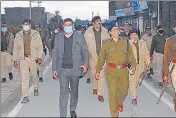  ?? ?? US Nagar district administra­tion led by DM Yugal Kishore Pant, SSP DS Kunwar holds a flag march in Rudrapur on Monday.