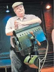  ?? PHOTOGRAPH­Y BY JOHN RENNISON, THE HAMILTON SPECTATOR ?? Brian Morton with a light from the Lyric Theatre in Hamilton.