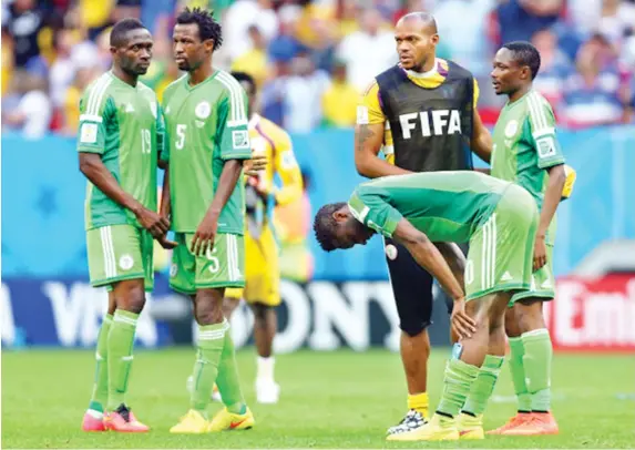  ??  ?? John Obi Mikel of Nigeria reacts with teammates after being defeated by France 2-0 during the 2014 FIFA World Cup Brazil Round of 16 match
between France and
Nigeria