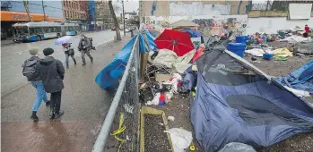  ?? ARLEN REDEKOP ?? A tent city sprung up at 58 West Hastings, site of a proposed affordable housing project, last summer, and was later cleared by municipal authoritie­s.