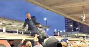  ??  ?? Clockwise from far left: a commuter grabs the ankle of a protester, identified as James Mee, who is dragged off the carriage; a second campaigner, believed to be Mark Ovland, is also hauled off the roof of a train at Canning Town station; commuters vent their fury at being unable to board the train during the morning rush hour