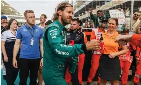  ?? Photograph: Beata Zawrzel/ZUMA Press Wire/ Shuttersto­ck ?? Sebastian Vettel is greeted during the drivers’ parade at Abu Dhabi on Sunday as fans hold a ‘danke Seb’ sign in the background.