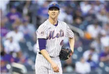  ?? Elsa / TNS ?? Jacob deGrom won’t pitch again until the tightness in his right forearm abates. An MRI exam found no issues with his elbow.