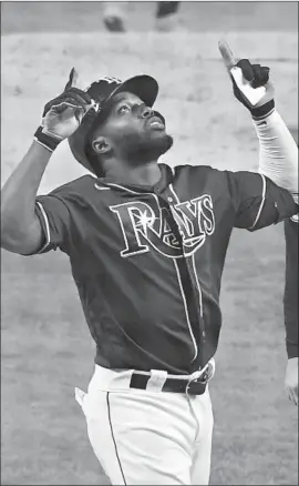  ?? Wally Skalij Los Angeles Times ?? RANDY AROZARENA of the Rays points to the heavens after hitting a solo homer in the fourth inning, giving him a major-league record nine in one postseason.