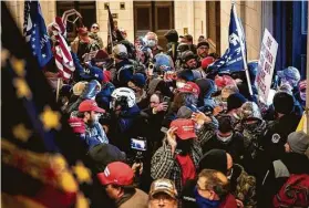  ?? Erin Schaff / New York Times ?? A pro-Trump mob packs into the Capitol onWednesda­y. The building was placed under lockdown, and members of Congress were forced to flee a joint session.