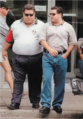  ?? ?? Angelo Musitano, right, and Pat Musitano leaving provincial court for lunch on Sept. 9, 1998.