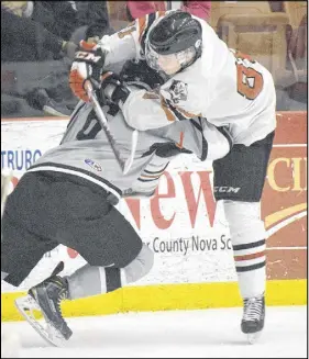  ?? TRURO DAILY NEWS PHOTO ?? Cameron MacLeod, who had a goal and an assist in Saturday night’s preseason win over the Wildcats, attempts to sidestep a check.