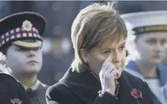  ??  ?? Clockwise from above: Nicola Sturgeon in Edinburgh and the Queen, watching the Cenotaph ceremony in London, are caught up in the emotion; former commandoes honour the dead at Spean Bridge; Hearts owner Ann Budge lays a wreath at Haymarket in...