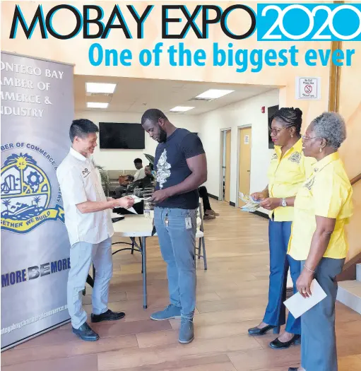  ??  ?? Directors of the Montego Bay Chamber of Commerce and Industry Expo team Yansen Li (left), Karlene Maye (second right), and Mary Chambers giving out informatio­n to prospectiv­e attendees of MoBay Expo 2020 at ACT at the Barnett Tech Park recently.