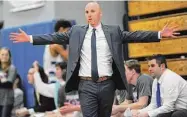  ?? Erik Trautmann/Hearst Connecticu­t Media ?? Fairfield Ludlowe coach John Dailey talks to his players as his team takes on Fairfield Warde in 2019.