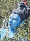  ?? BL SONI ?? A man cleans a 75-feet high statue of Lord Shiva on the occasion of upcoming Mahashivra­tri festival at Mahadev Mandir, Ghatkopar on Saturday.