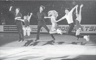  ?? CANADIAN PRESS FILE PHOTO ?? From left, gold-medallists Michael Marinaro and Kirsten Moore-Towers, pairs; Andrew Poje and Kaitlyn Weaver, ice dance; Nam Nguyen, senior men; and Alaine Chartrand, senior women, jump for a photo at the exhibition gala event at the 2019 National Skating Championsh­ips at Harbour Station in Saint John, N.B., on Jan. 20.